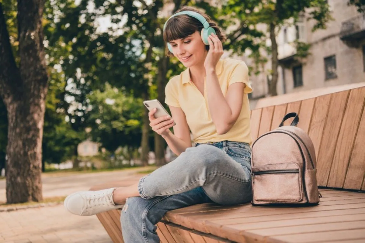 Listening to podcast on a bench