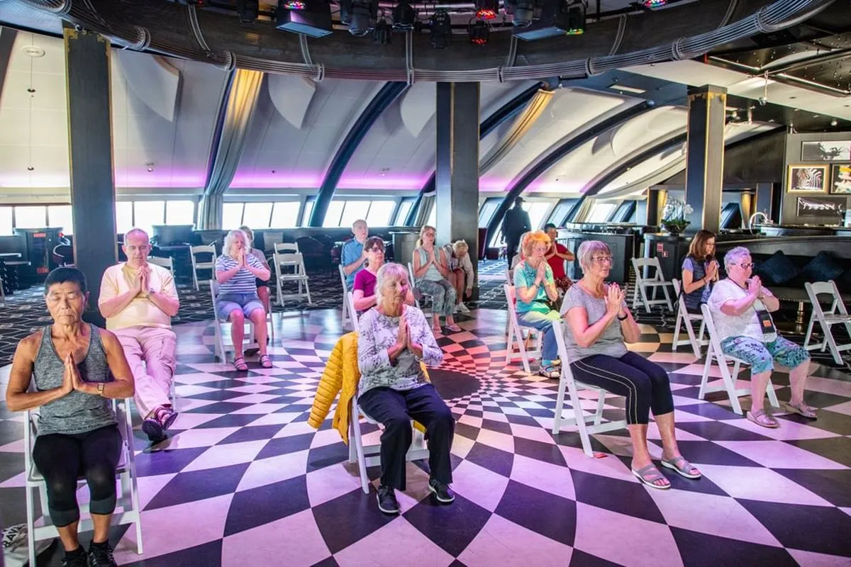 A group of people practicing meditation