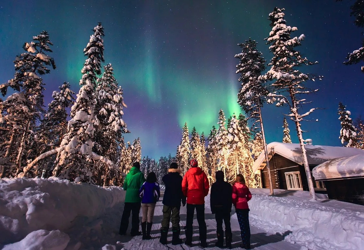 People looking at the Northern Lights