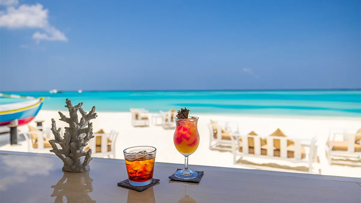 Couple glasses of chilled cocktails with rum on a Caribbean Beach