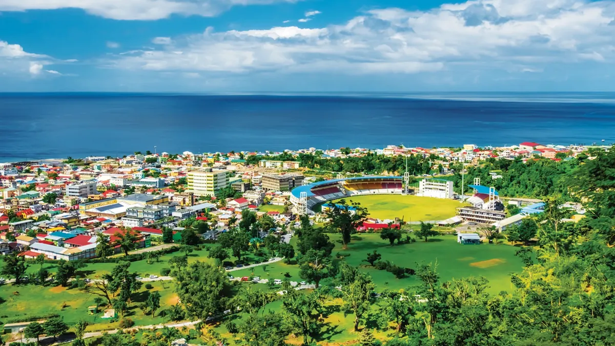 Bright and colourful aerial view of coastline and buildings of Roseau, Dominica.