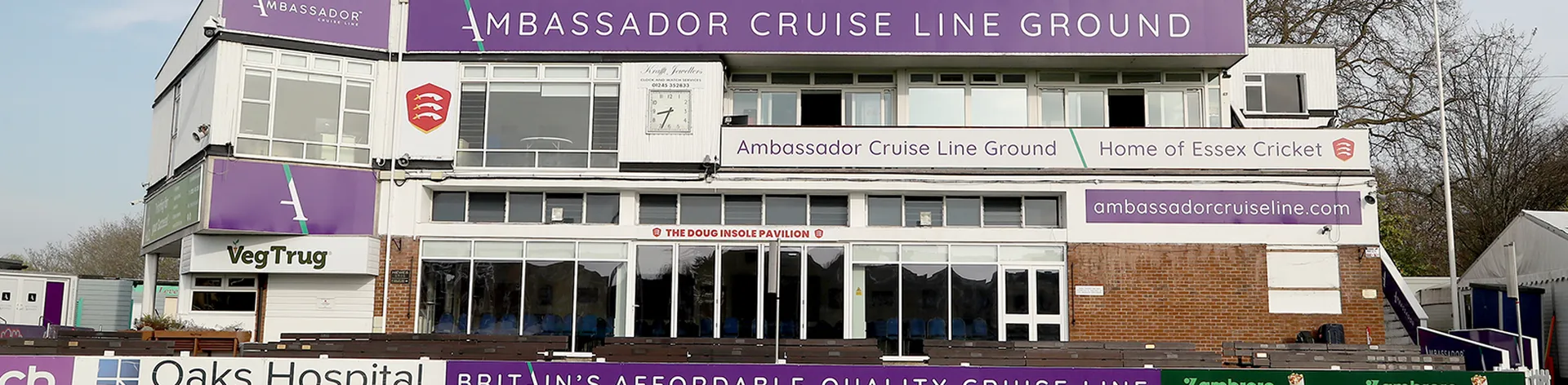 Exterior of the Ambassador Cruise Line Ground pavilion with sponsor banners