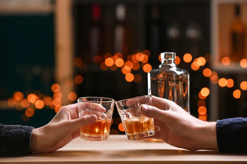 Couple drinking Whiskey in bar
