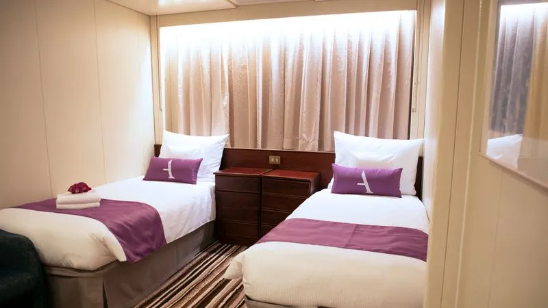 Twin room aboard Ambience by Ambassador Cruise Line