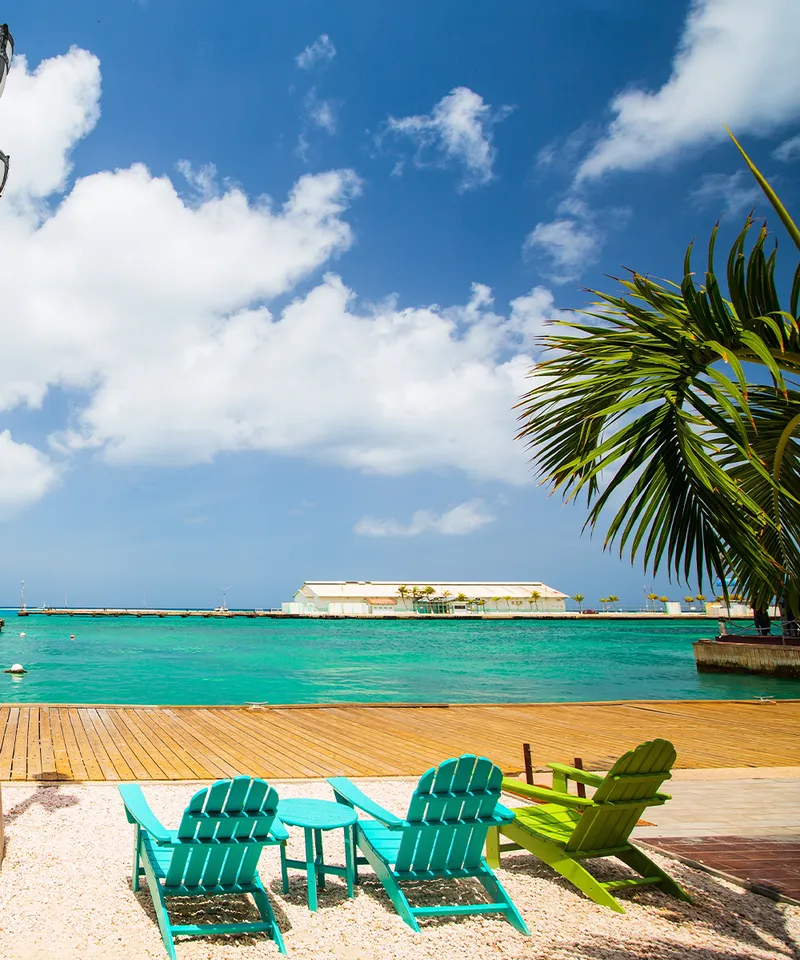 Idyllic tropical waterfront in Oranjestad in Caribbean Aruba island with view of turquoise ocean water