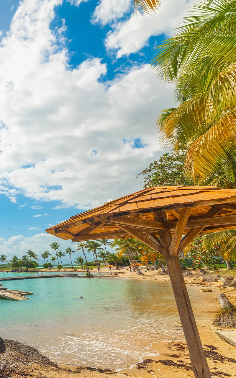 Sun shining over beautiful Bas du Fort beach in Guadeloupe. Lesser Antilles, Caribbean sea