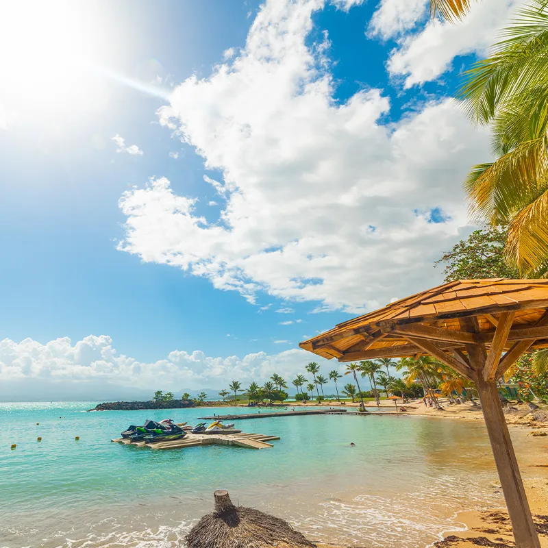 Sun shining over beautiful Bas du Fort beach in Guadeloupe. Lesser Antilles, Caribbean sea