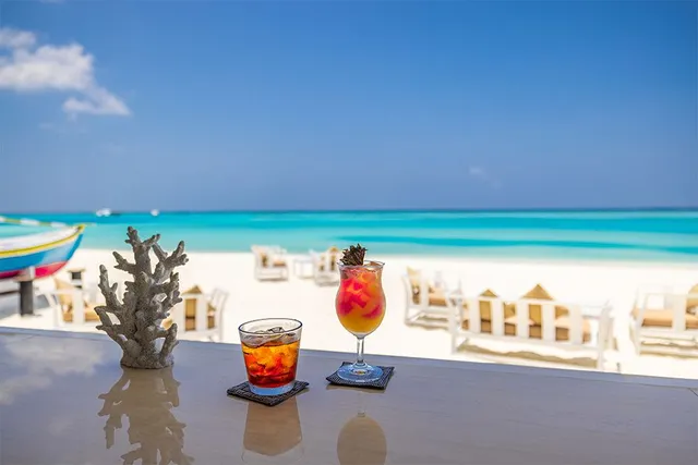 Couple glasses of chilled cocktails with rum on a Caribbean Beach