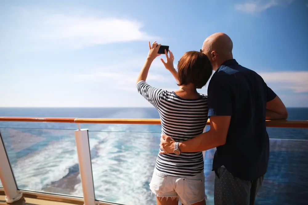 Couple taking a photo on a cruise ship