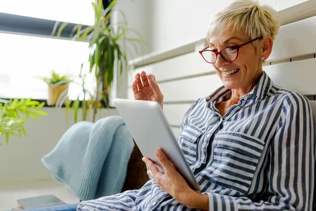 Stylish woman using tablet computer
