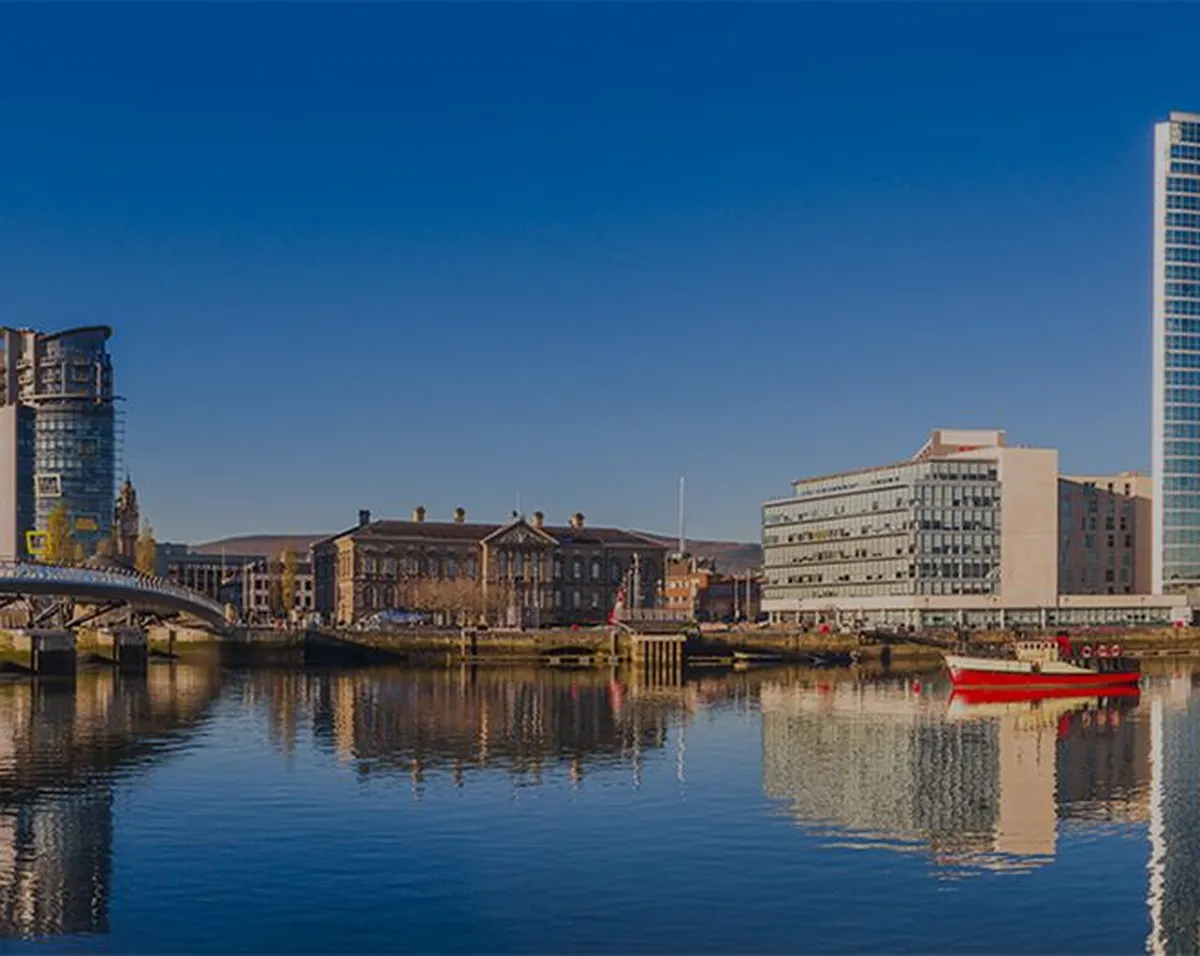 Panoramic view of Belfast with modern buildings beside a river