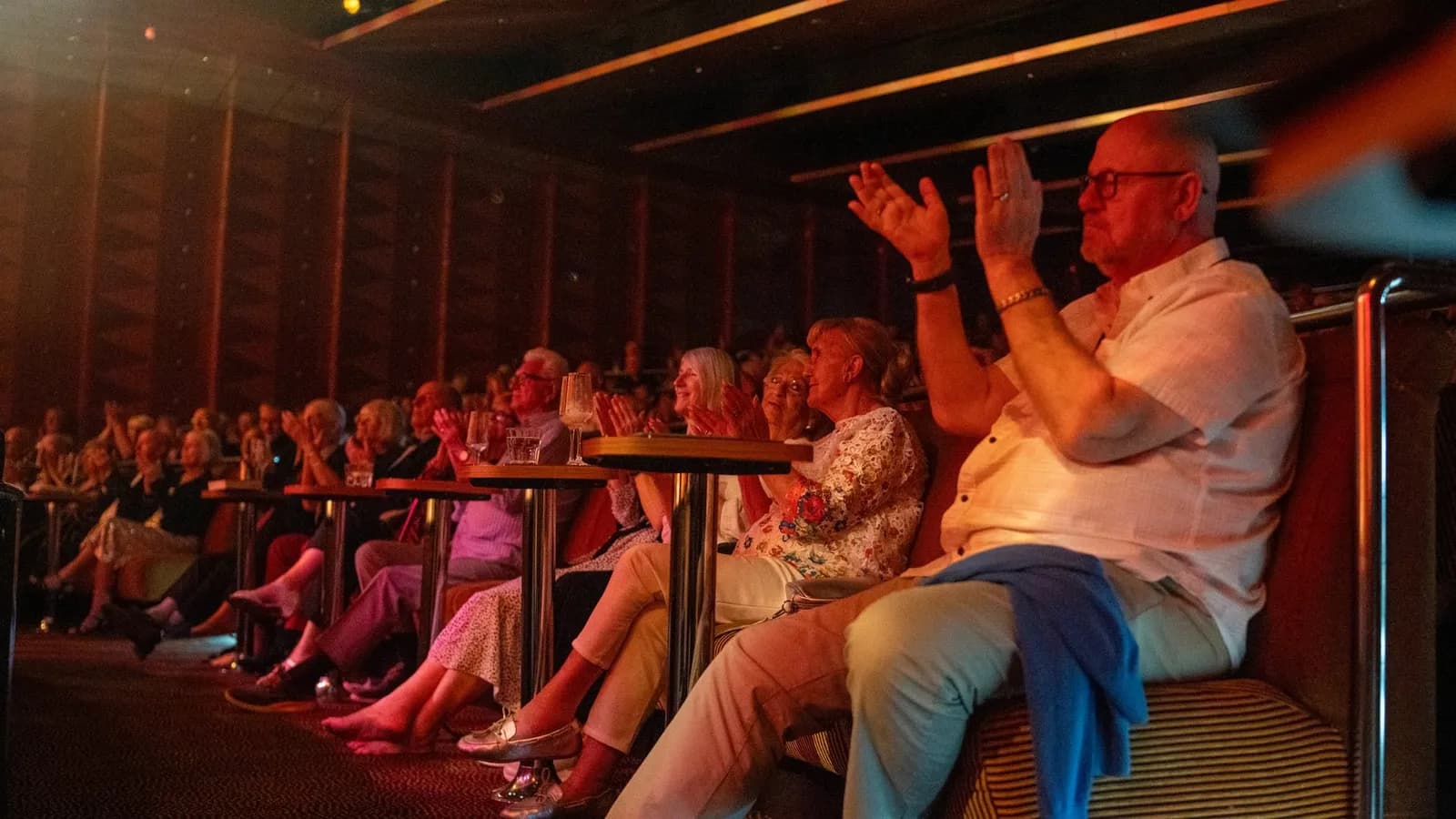 Audience seated in the Palladium theater on Ambition applauding