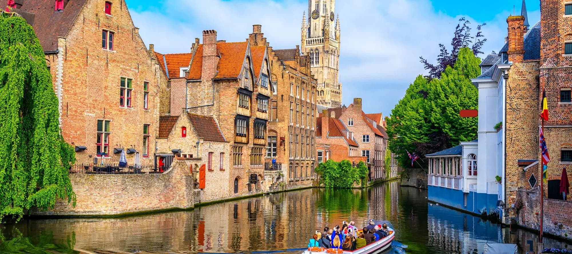 Classic view of the historic city center with canal in Brugge, West Flanders province, Belgium. Cityscape of Bruges.