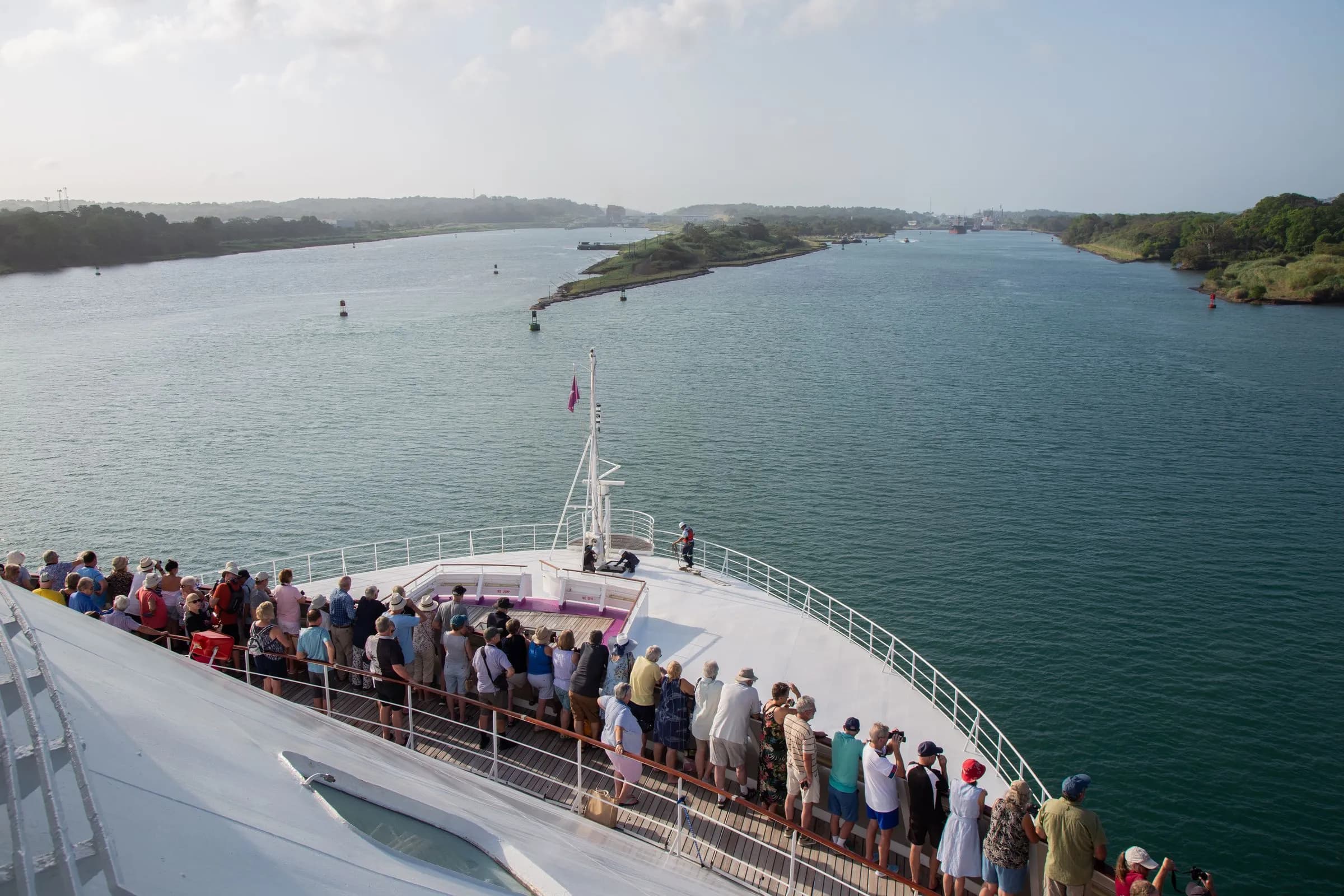 Guests on Ambience cruise ship watching the arrival at the Panama Canal on a World Cruise