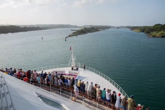 Guests on Ambience cruise ship watching the arrival at the Panama Canal on a World Cruise