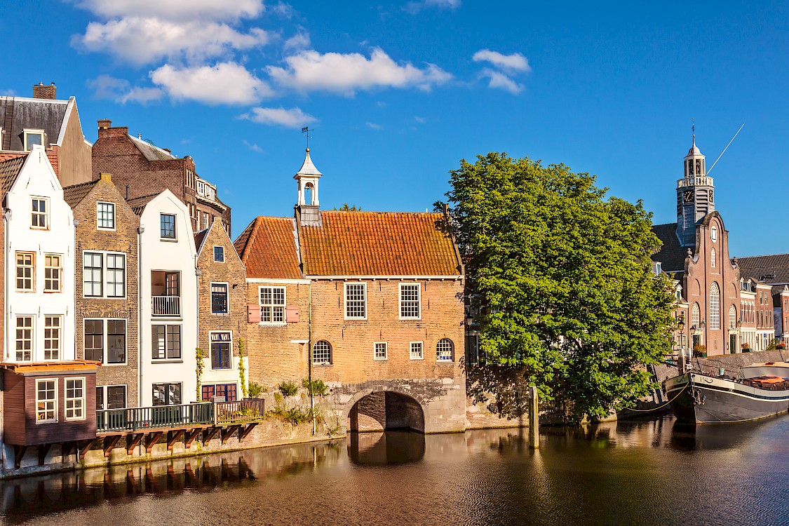 Summer view of medieval houses alongside a canal in Delfshaven