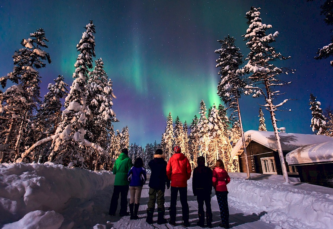 People looking at the Northern Lights